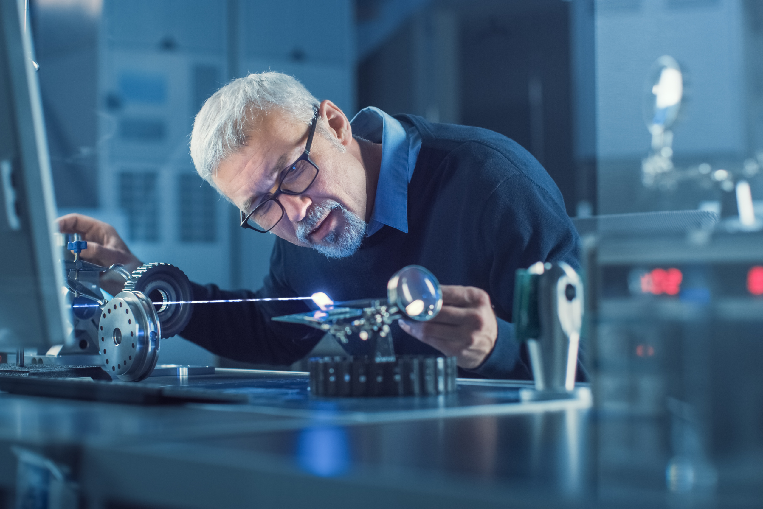 Photo of Man in Laboratory working on Laser Tech as a Blog Header